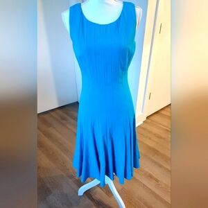 Calvin Klein blue sleeveless scoop neckline fit and flare 41' length dress.